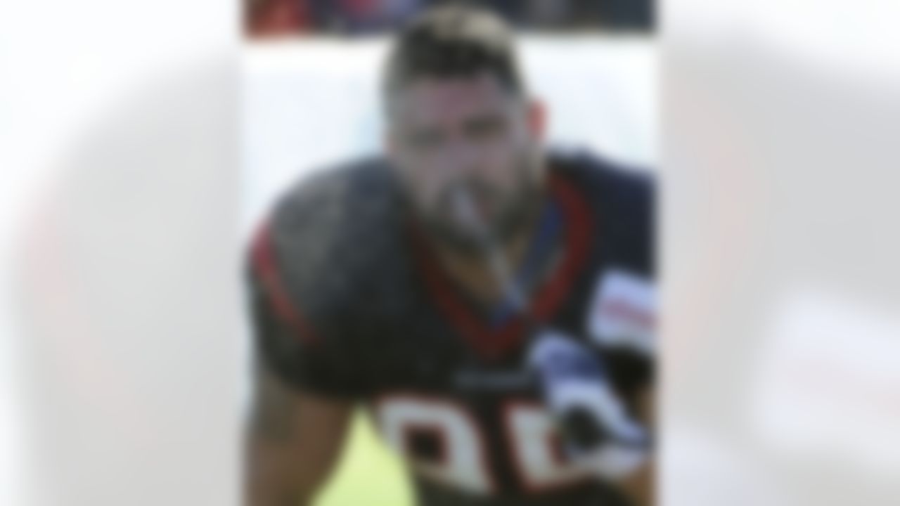 Houston Texans' Logan Brock beats the summer heat with a cold spray of water during training camp Monday, July 30, 2012, in Houston. (AP Photo/Pat Sullivan)