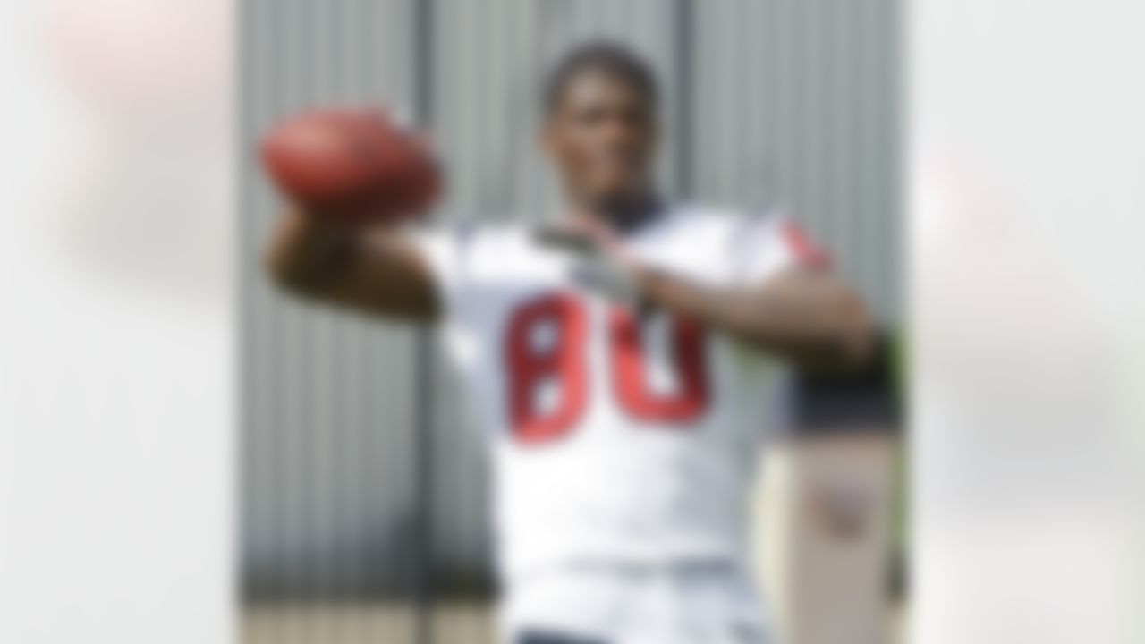 Houston Texans receiver Andre Johnson warms up during an NFL football mini camp, Thursday, May 20, 2010, in Houston. Johnson is in a contract dispute with the Texans and missed the opening three voluntary practices. (AP Photo/Dave Einsel)