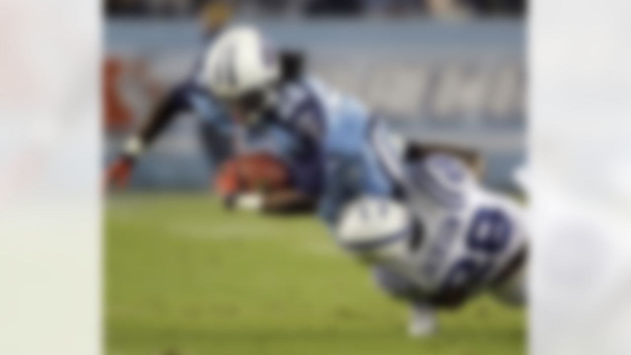 Tennessee Titans running back Chris Johnson (28) is brought down by Indianapolis Colts cornerback Marlin Jackson (28) during the first quarter of an NFL football game in Nashville, Tenn., Monday, Oct. 27, 2008. (AP Photo/Mark Humphrey)