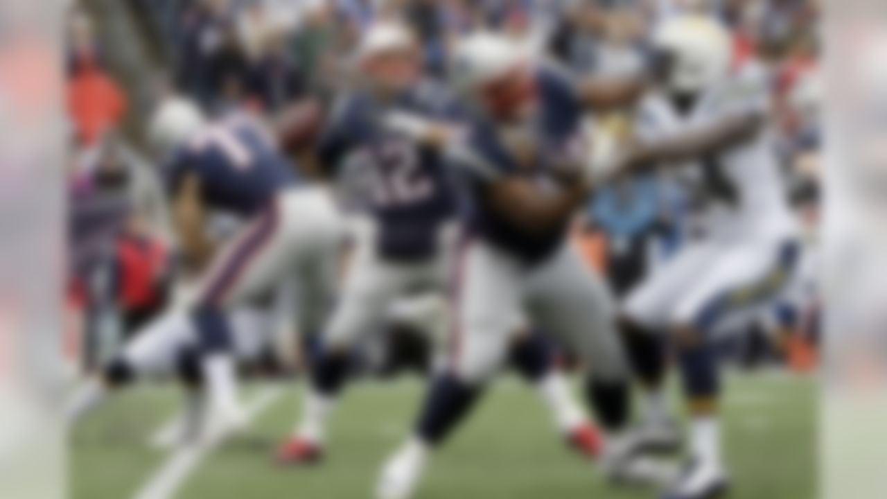 New England Patriots quarterback Tom Brady (12) passes behind blocking during the first half of an NFL football game against the Los Angeles Chargers, Sunday, Oct. 29, 2017, in Foxborough, Mass. (AP Photo/Steven Senne)