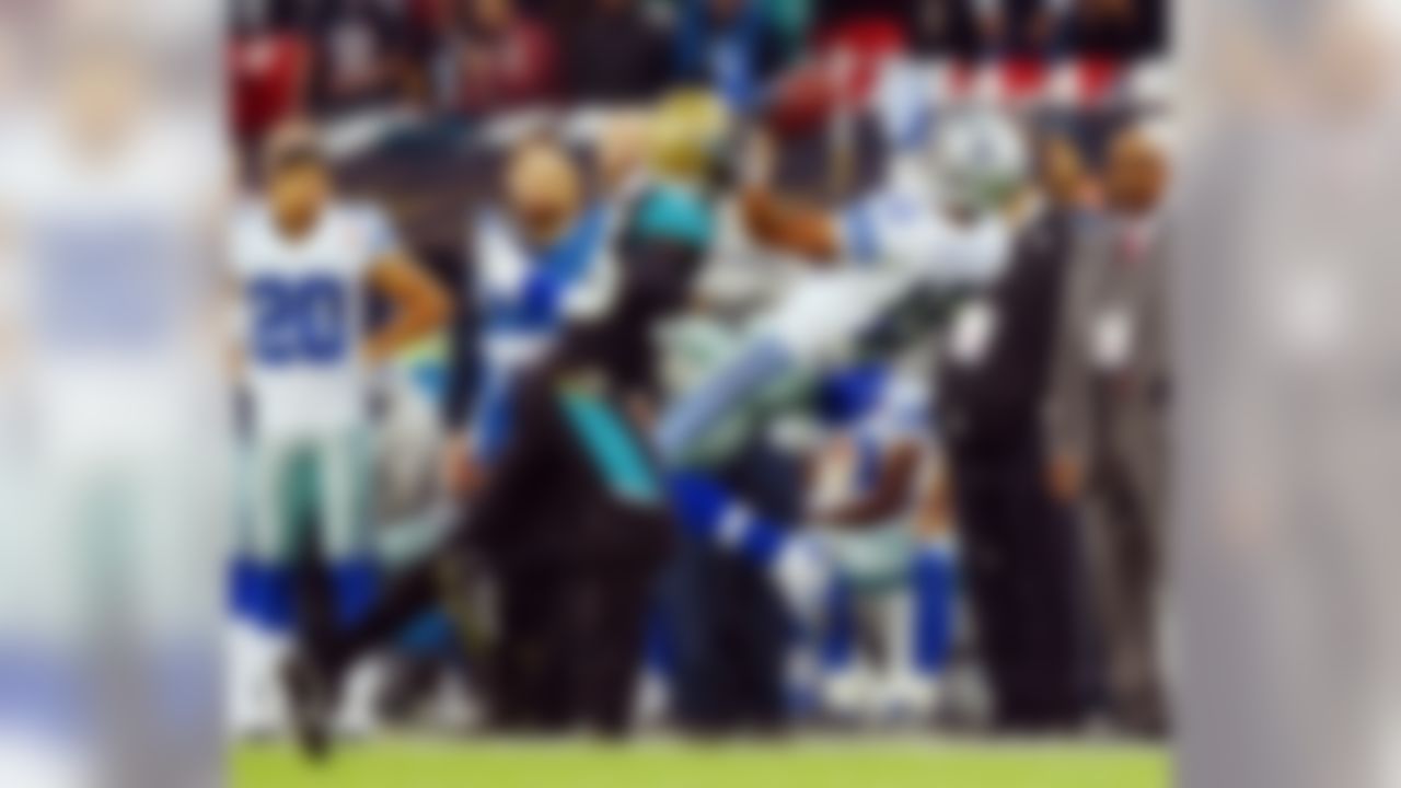 Dallas Cowboys wide receiver Devin Street (15) and Jacksonville Jaguars defensive back Sherrod Martin (25) reach for a pass during the NFL football game at Wembley Stadium, London, Sunday, Nov. 9, 2014.  (AP Photo/Matt Dunham)