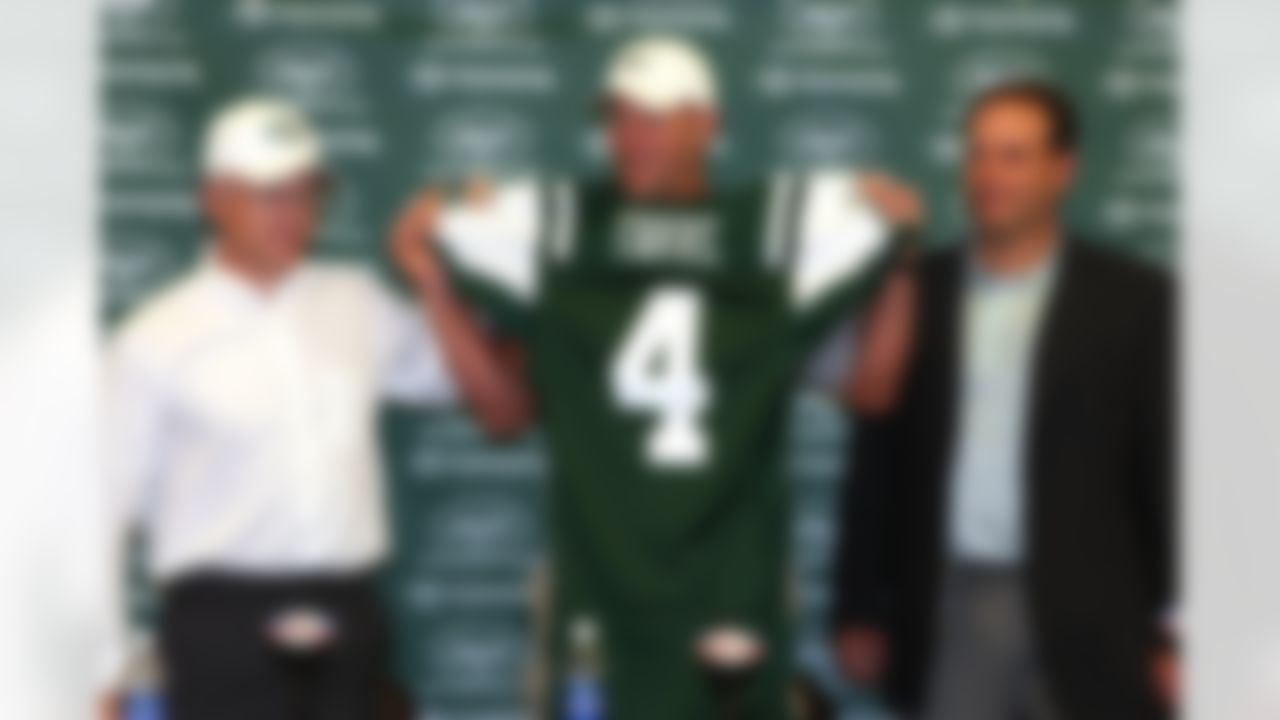 CLEVELAND, OH - AUGUST 7: Brett Favre holds up his New York Jets jersey alongside Chairman and CEO Woody Johnson (L) and Executive Vice President/General Manager Mike Tannenbaum (R) during a press conference on August 7, 2008 in Cleveland, Ohio. The press conference was held prior to a preseason game against the Cleveland Browns. (Photo by Joe Robbins/Getty Images)