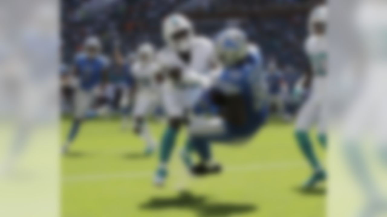 Detroit Lions tight end Michael Roberts (80) catches a pass in the endzone for a touchdown as Miami Dolphins linebacker Jerome Baker (55) defends, during the first half of an NFL football game, Sunday, Oct. 21, 2018, in Miami Gardens, Fla. (AP Photo/Lynne Sladky)