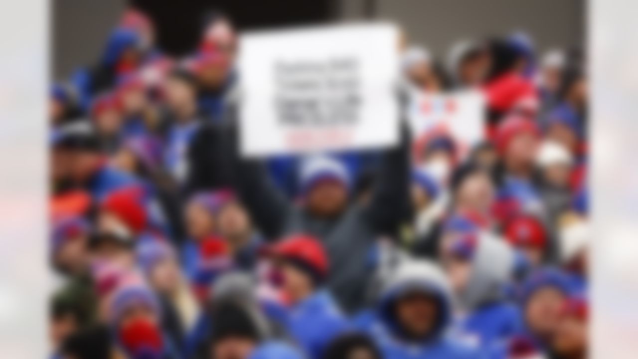 Fans hold up signs in support of Buffalo Bills safety Damar Hamlin during the first half of an NFL football game against the New England Patriots, Sunday, Jan. 8, 2023, in Orchard Park. Hamlin remains hospitalized after suffering a catastrophic on-field collapse in the team's previous game against the Cincinnati Bengals.
