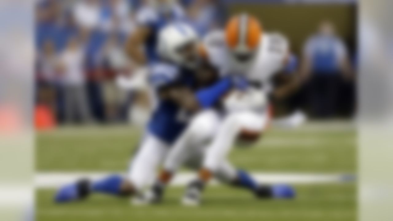 Indianapolis Colts cornerback Greg Toler, left, strips the ball away from Cleveland Browns wide receiver Greg Little during the first half of a preseason NFL football game in Indianapolis, Saturday, Aug. 24, 2013. Toler recovered the fumble. (AP Photo/Jeff Roberson)