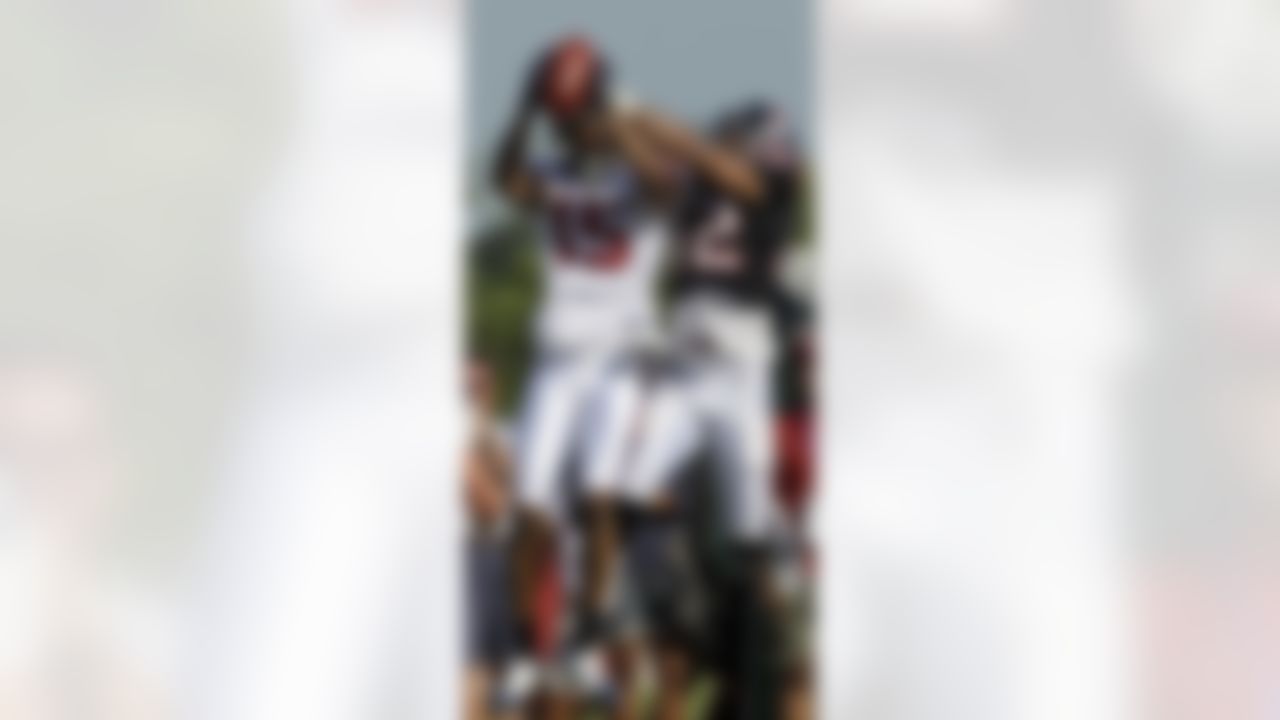 Houston Texans wide receiver Bobby Williams (15) goes up to catch a pass as safety Tom Williams (42) defends during a NFL football training camp practice Monday, Aug. 2, 2010 in Houston. (AP Photo/David J. Phillip)