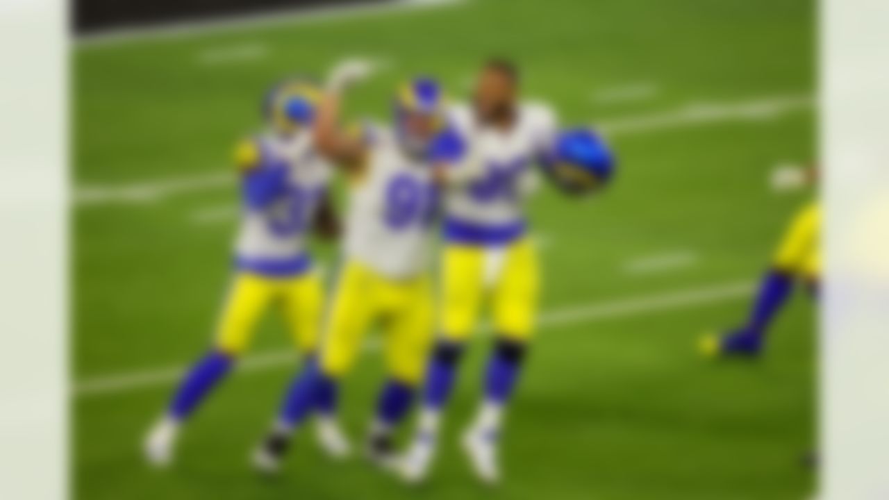 Los Angeles Rams defensive end Aaron Donald (99) and defensive tackle Greg Gaines (91) celebrate after winning Super Bowl LVI on Sunday, February 13, 2022 in Inglewood, California. (Mikey Owens/NFL)