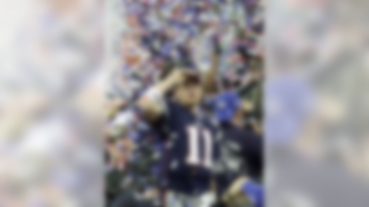New England Patriots quarterback Drew Bledsoe (11) is covered up in confetti after the Patriots beat the St. Louis Rams in Super Bowl XXXVI at the  Louisiana Superdome Sunday, Feb. 3, 2002 in New Orleans.  (AP Photo/Beth A. Keiser)