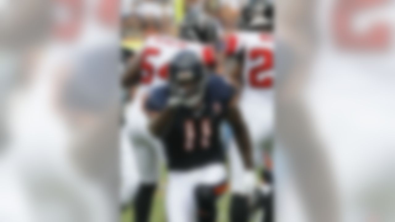 Chicago Bears wide receiver Roy Williams (11) reacts after a pass-reception against the Atlanta Falcons in the first half of an NFL football game in Chicago, Sunday, Sept. 11, 2011. (AP Photo/Charles Rex Arbogast)