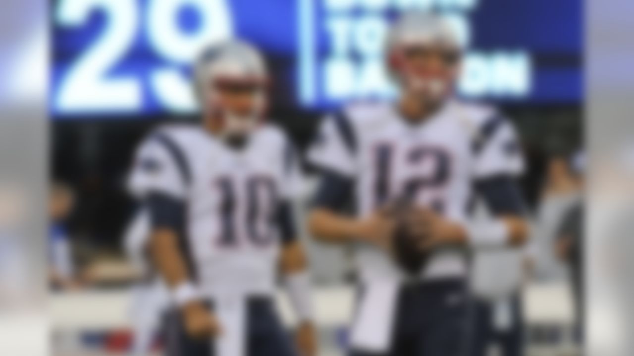 New England Patriots quarterbacks Tom Brady (12) and Jimmy Garoppolo (10) warm up before the team's preseason NFL football game against the New York Giants on Thursday, Sept. 1, 2016, in East Rutherford, N.J. (AP Photo/Bill Kostroun)