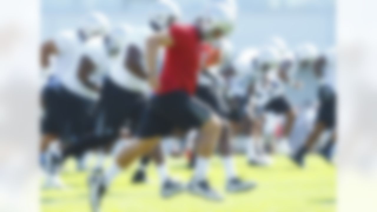Detroit Lions quarterback Matthew Stafford (9) runs sprints during their NFL football training camp practice at the Detroit Lions training facility in Allen Park, MI, Saturday, July 30, 2011. (AP Photo/Rick Osentoski)