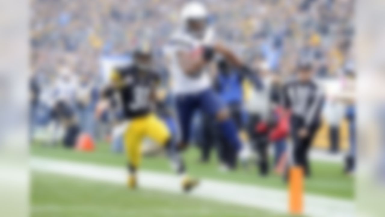 San Diego Chargers wide receiver Danario Alexander (84) scores a touchdown against Pittsburgh Steelers defensive back Curtis Brown (31) during the second quarter of an NFL football game on Sunday, Dec. 9, 2012, in Pittsburgh. San Diego won 34-24.(AP Photo/Don Wright)