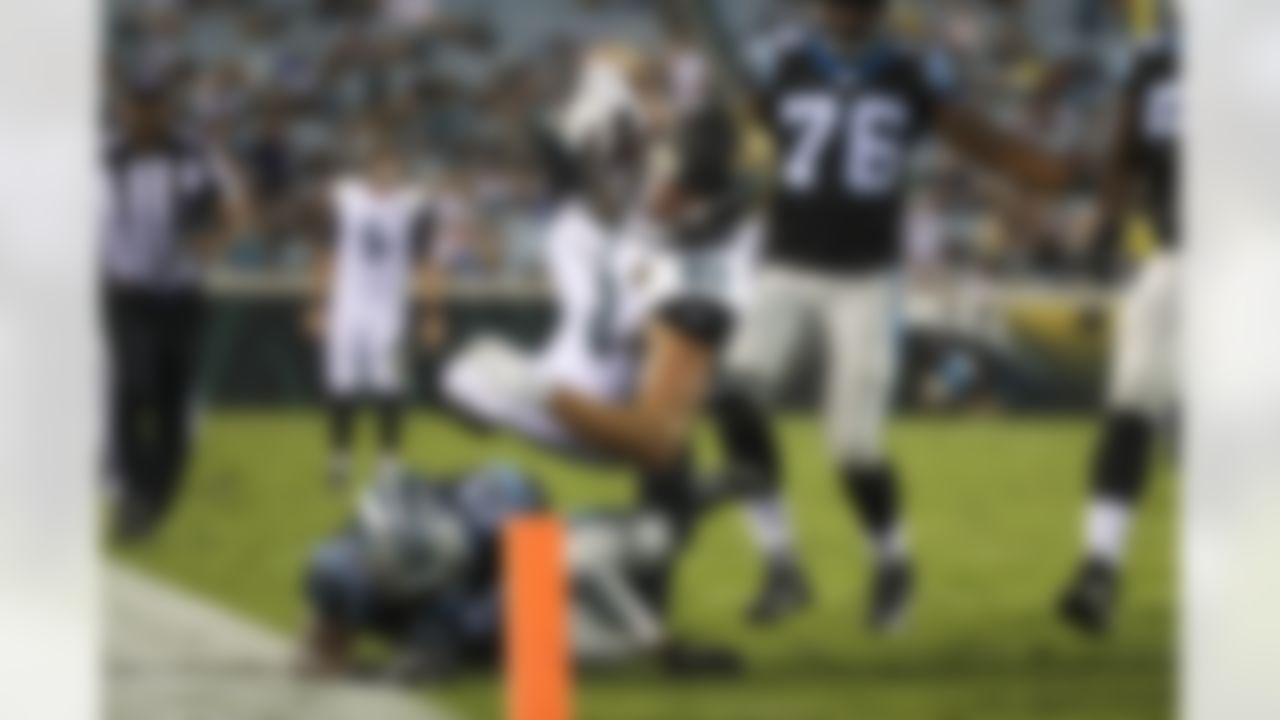 Jacksonville Jaguars tight end Ben Koyack (83) dives for the end zone as Carolina Panthers defensive back Damian Parms (25) defends during a NFL preseason game, Thursday, Aug. 24, 2017 in Jacksonville, Fla. (Logan Bowles / NFL)