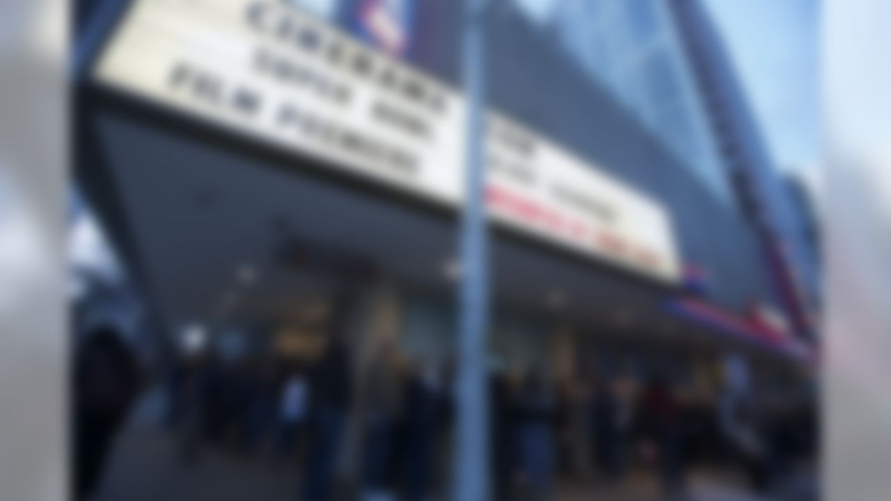 Fans wait in line outside a movie theater before the premiere of NFL Films' "Super Bowl XLVIII Champions Seattle Seahawks" Monday, March 3, 2014, in Seattle. The film highlights key plays from the Seahawks' 2013 season and Super Bowl win over the Denver Broncos. The film will be available on DVD, Blu-Ray and at iTunes. (AP Photo/Stephen Brashear)