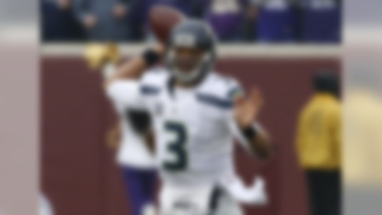 Seattle Seahawks quarterback Russell Wilson throws against the Minnesota Vikings in the first half of an NFL football game Sunday, Dec. 6, 2015 in Minneapolis. (AP Photo/Ann Heisenfelt)
