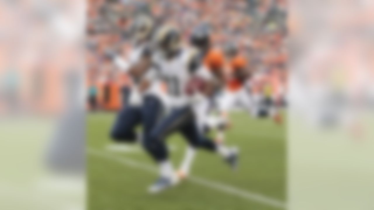 St. Louis Rams wide receiver Tavon Austin (11) runs a punt return back 81 yards against the Denver Broncos in the first quarter of a preseason NFL football game, Saturday, Aug. 24, 2013, in Denver. (AP Photo/Joe Mahoney)