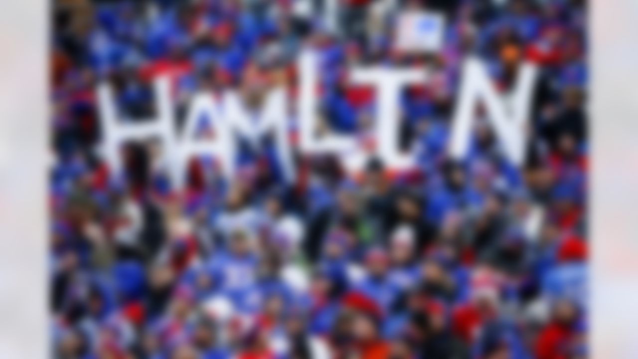 Fans hold a sign in support of Buffalo Bills safety Damar Hamlin during the second half of an NFL football game against the New England Patriots, Sunday, Jan. 8, 2023, in Orchard Park. Hamlin remains hospitalized after suffering a catastrophic on-field collapse in the team's previous game against the Cincinnati Bengals.
