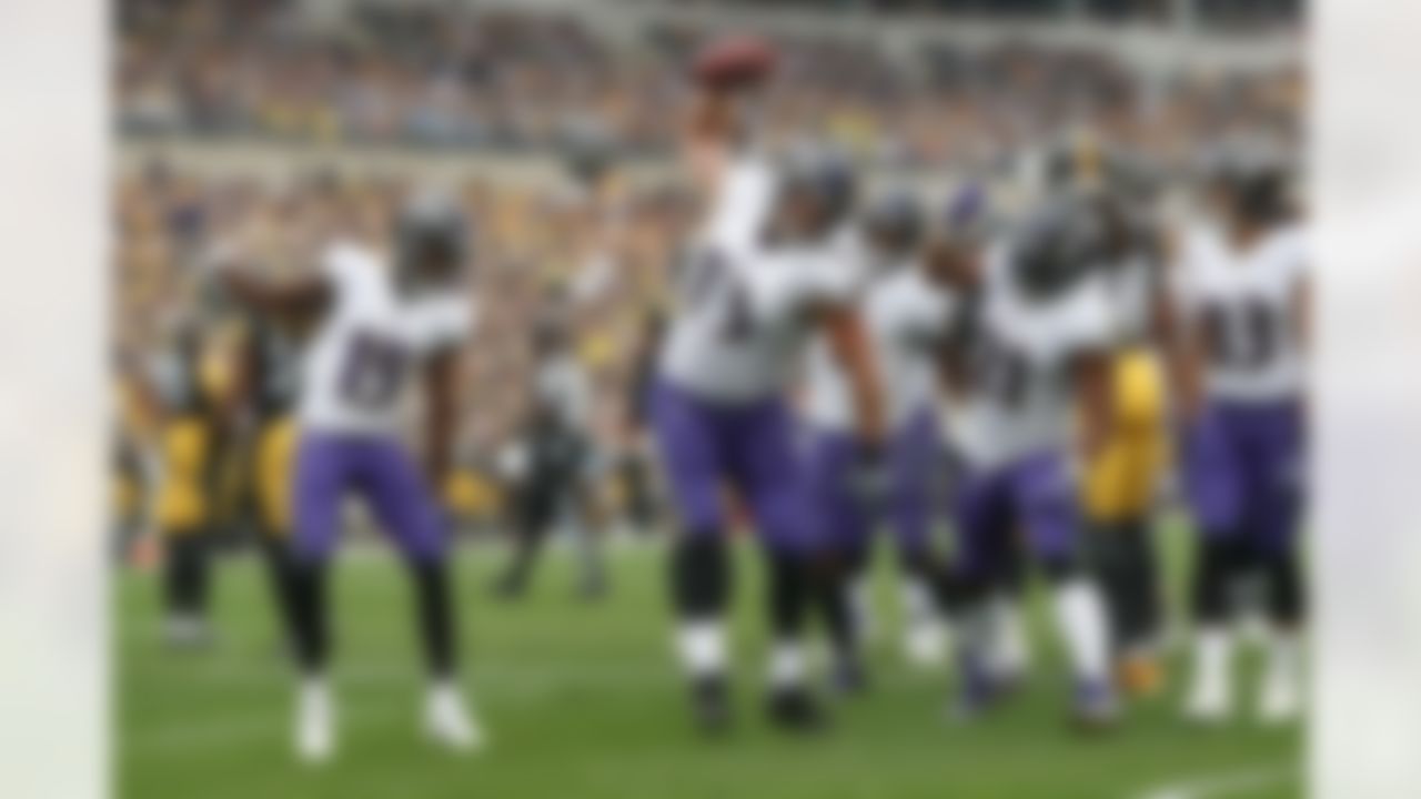 Baltimore Ravens offensive guard Marshal Yanda (73) spikes the football as he celebrates with teammates after running back Mark Ingram (21) scored against the Pittsburgh Steelers in the ]first half of an NFL football game, Sunday, Oct. 6, 2019, in Pittsburgh. (AP Photo/Don Wright)