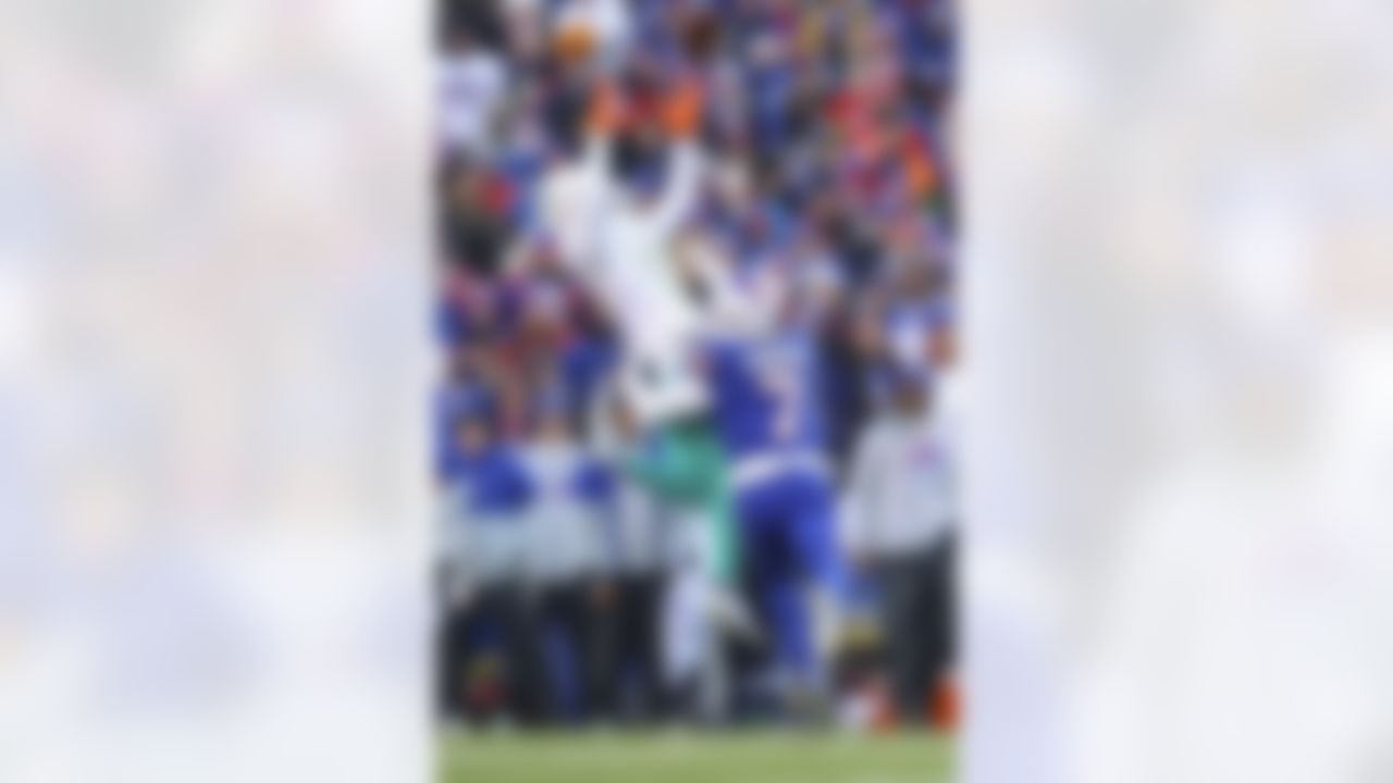 Miami Dolphins wide receiver Jaylen Waddle (17) tries to make a catch as Buffalo Bills cornerback Taron Johnson (7) attempts to break it up during an NFL Super Wild Card Weekend playoff game on Sunday, January 15, 2023 in Orchard Park, New York.