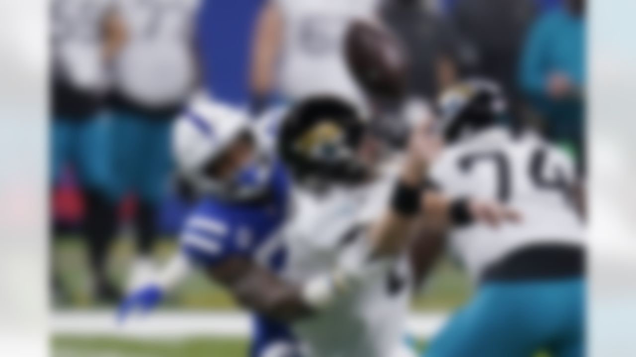 Jacksonville Jaguars quarterback Mike Glennon (2) fumbles the ball as hit by by Indianapolis Colts' Darius Leonard (53) during the first half of an NFL football game, Sunday, Jan. 3, 2021, in Indianapolis.