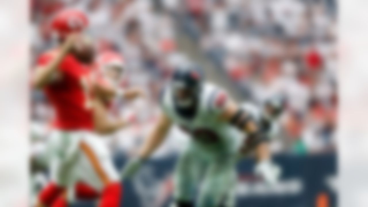 Kansas City Chiefs quarterback Alex Smith (11) throws a pass under pressure from Houston Texans defensive end J.J. Watt (99) during an NFL football game at NRG Stadium on Sunday, September 13, 2015 in Houston, Texas. Kansas City won 27-20. (Aaron M. Sprecher via AP)