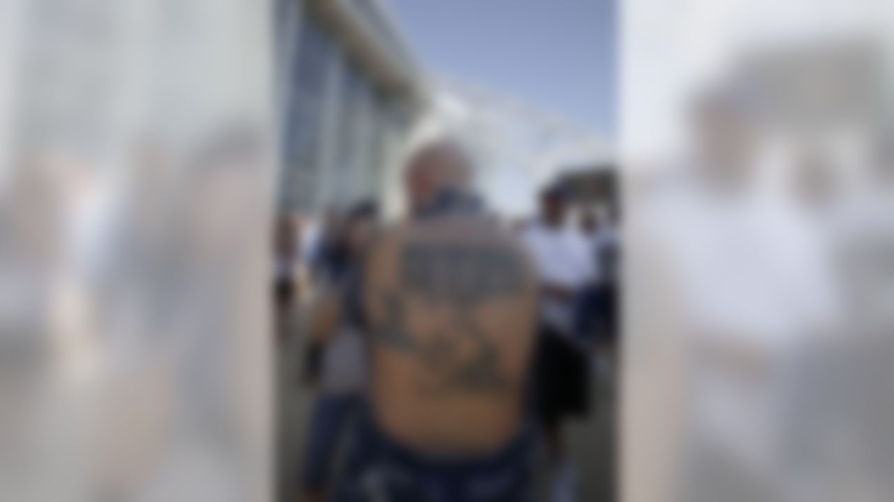 A Dallas Cowboys fan shows off his tattoo outside Cowboys Stadium before an NFL football game against the Chicago Bears Sunday, Sept. 19, 2010 in Arlington, Texas. (AP Photo/Sharon Ellman)