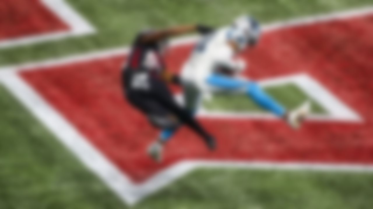 Carolina Panthers safety Juston Burris (right) intercepts the ball against Atlanta Falcons wide receiver Russell Gage.