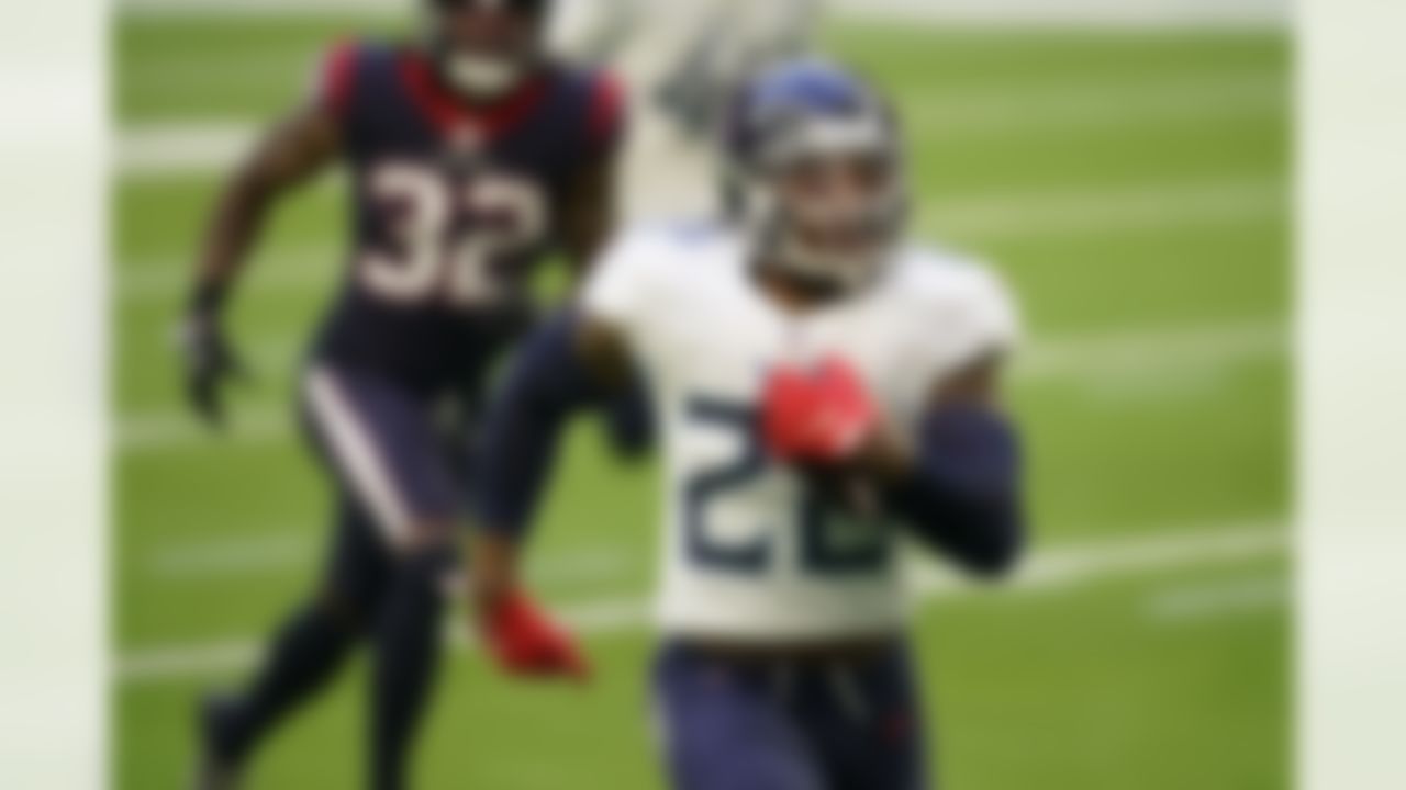 Tennessee Titans running back Derrick Henry (22) runs the ball during an NFL football game against the Houston Texans on Sunday, January 3, 2021 in Houston, Texas.