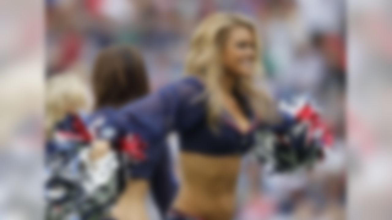 New England Patriots cheerleaders perform during the fourth quarter of an NFL football game against the Oakland Raiders Sunday, Sept. 21, 2014, in Foxborough, Mass. (AP Photo/Stew Milne)