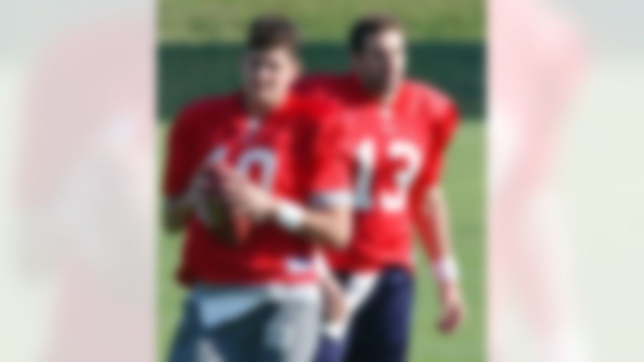 St. Louis Rams quarterbacks Kurt Warner, right, and Marc Bulger take part in the Rams' practice in St. Louis on Sept. 18, 2002. Warner, now the starting quarterback for the Arizona Cardinals, will play against his former team and Bulger when the two teams play in Arizona on Sunday, Sept. 18, 2005. (AP Photo/James A. Finley)