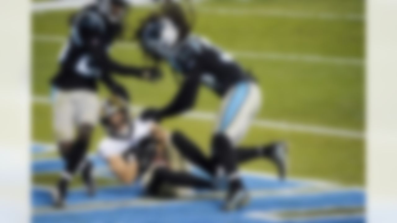 New Orleans Saints wide receiver Austin Carr scores between Carolina Panthers cornerback Donte Jackson and free safety Tre Boston during the second half of an NFL football game Sunday, Jan. 3, 2021, in Charlotte, N.C.