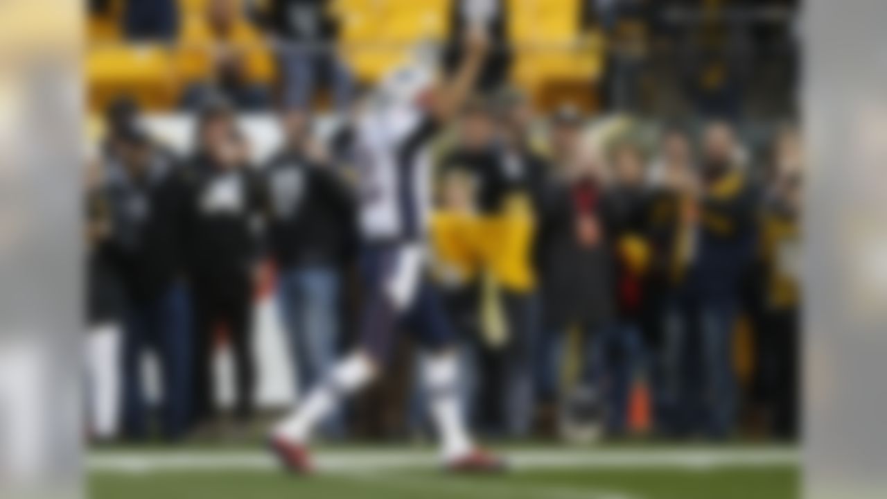 New England Patriots quarterback Tom Brady (12) acknowledges fans as he walks onto the field for warmups before an NFL football game against the Pittsburgh Steelers in Pittsburgh, Sunday, Dec. 17, 2017. (AP Photo/Keith Srakocic)