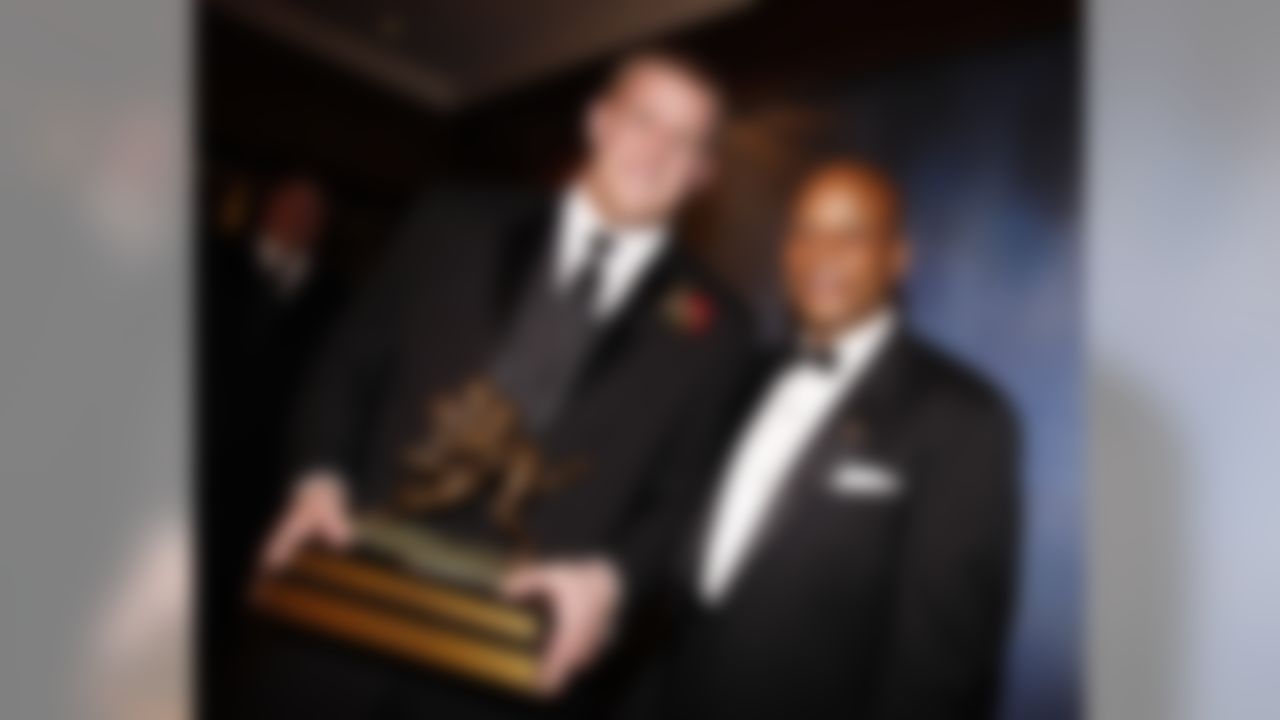 J.J. Watt of the University of  Wisconsin poses for a picture with Ronnie Lott after winning the 7th annual Lott IMPACT Trophy on Sunday, Dec. 12, 2010 in Newport Beach, Calif. The award is based on the player who has the biggest impact on his team on and off the field. (AP Photo/Christine Cotter)