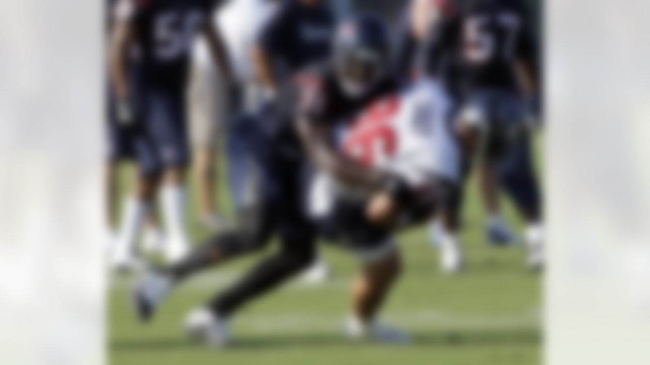 Houston Texans safety Bernard Pollard (31) tackles tight end James Casey (86) during a NFL football training camp practice Wednesday, Aug. 4, 2010 in Houston. (AP Photo/David J. Phillip)