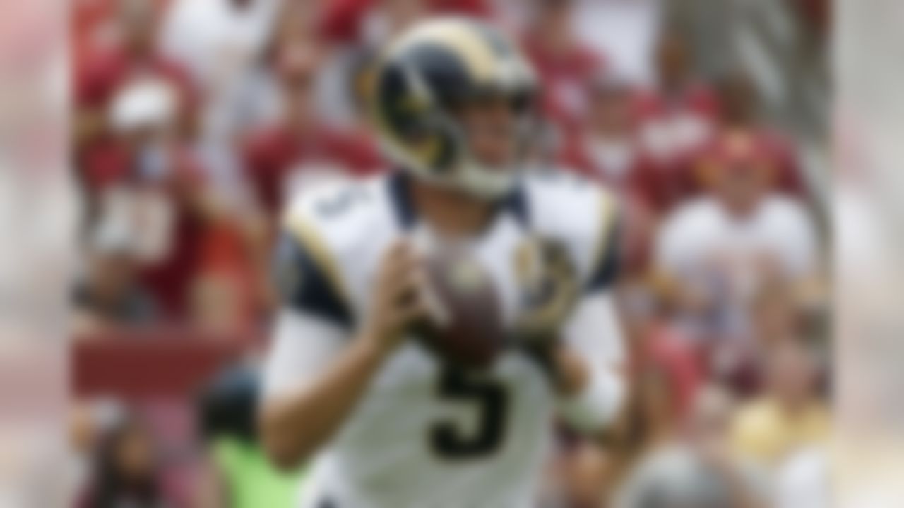 St. Louis Rams quarterback Nick Foles (5) looks for an open man during the first half of an NFL football game against the Washington Redskins in Landover, Md., Sunday, Sept. 20, 2015. (AP Photo/Alex Brandon)