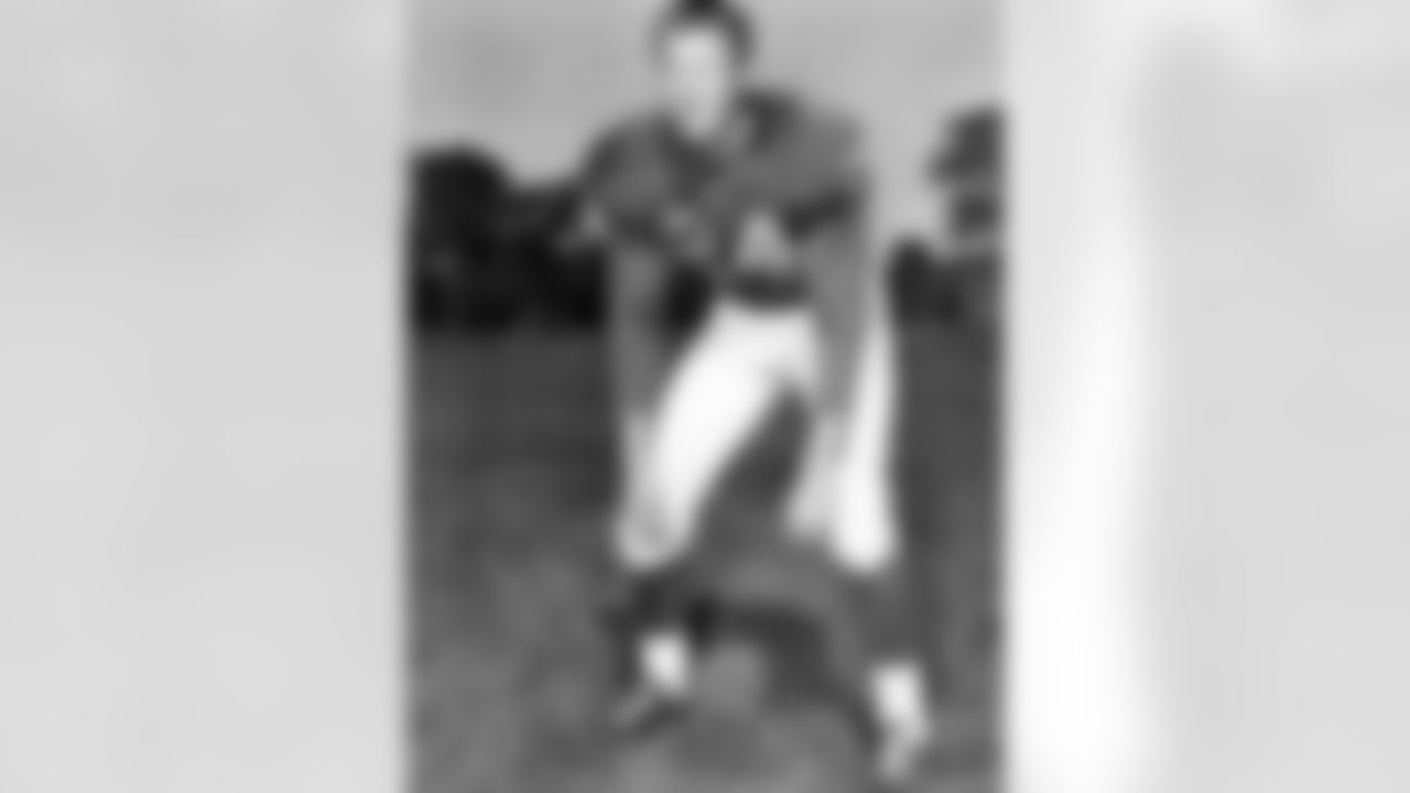 Detroit Lions safety Jack Christiansen (24) poses for a photo during training camp at Cranbrook Educational Community in Michigan, Aug. 22, 1957. (Pro Football Hall of Fame)