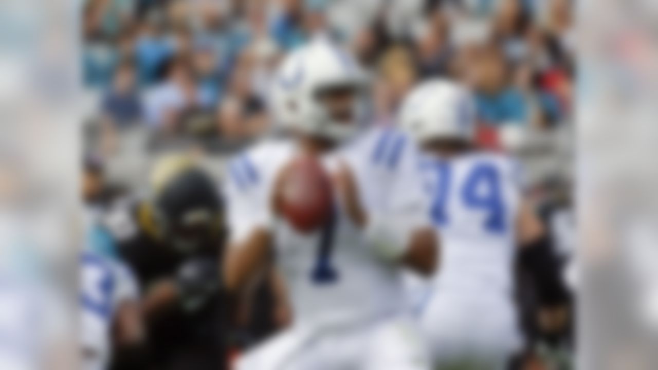 Indianapolis Colts quarterback Jacoby Brissett (7) looks for a receiver as he is rushed by Jacksonville Jaguars defensive lineman Calais Campbell (93) during the first half of an NFL football game, Sunday, Dec. 3, 2017, in Jacksonville, Fla. (AP Photo/John Raoux)