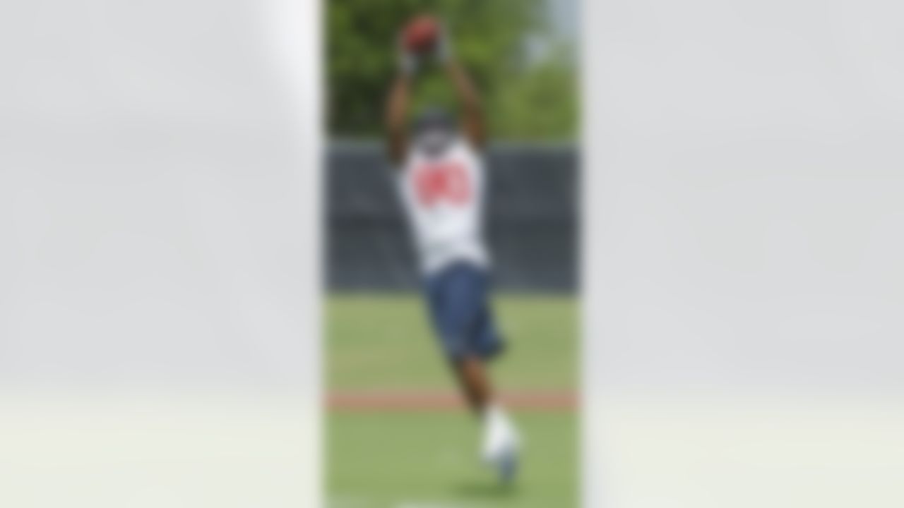 Houston Texans receiver Andre Johnson makes a catch during an NFL football mini camp, Thursday, May 20, 2010, in Houston. Johnson is in a contract dispute with the Texans and missed the opening three voluntary practices. (AP Photo/Dave Einsel)