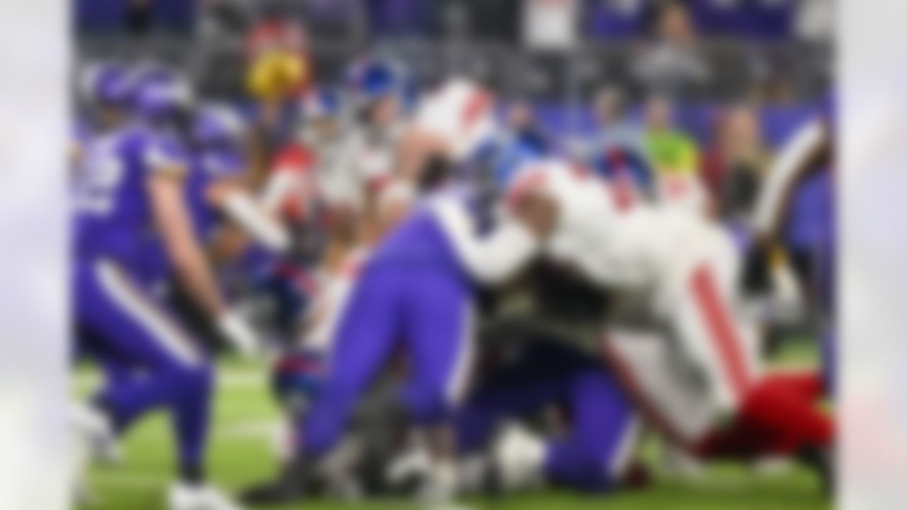 New York Giants quarterback Daniel Jones (8) runs a quarterback sneak to get a first down during the fourth quarter of an NFL Super Wild Card Weekend playoff game against the New York Giants on Sunday, January 15, 2023 in Minneapolis, Minnesota.