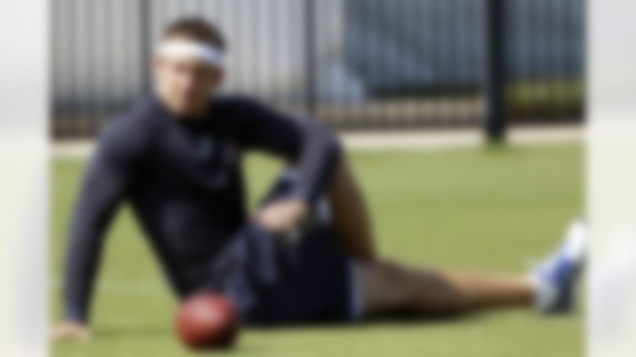 Houston Texans tight end Owen Daniels stretches during a NFL football workout Wednesday, May 26, 2010, in Houston. Daniels led the team with five touchdowns and was a favorite target of quarterback Matt Schaub last season before aseason-ending knee injury in the eighth game. The Texans look for him to return to that form this season, but for now he's still working to get healthy and back on the field with the team. (AP Photo/David J. Phillip)