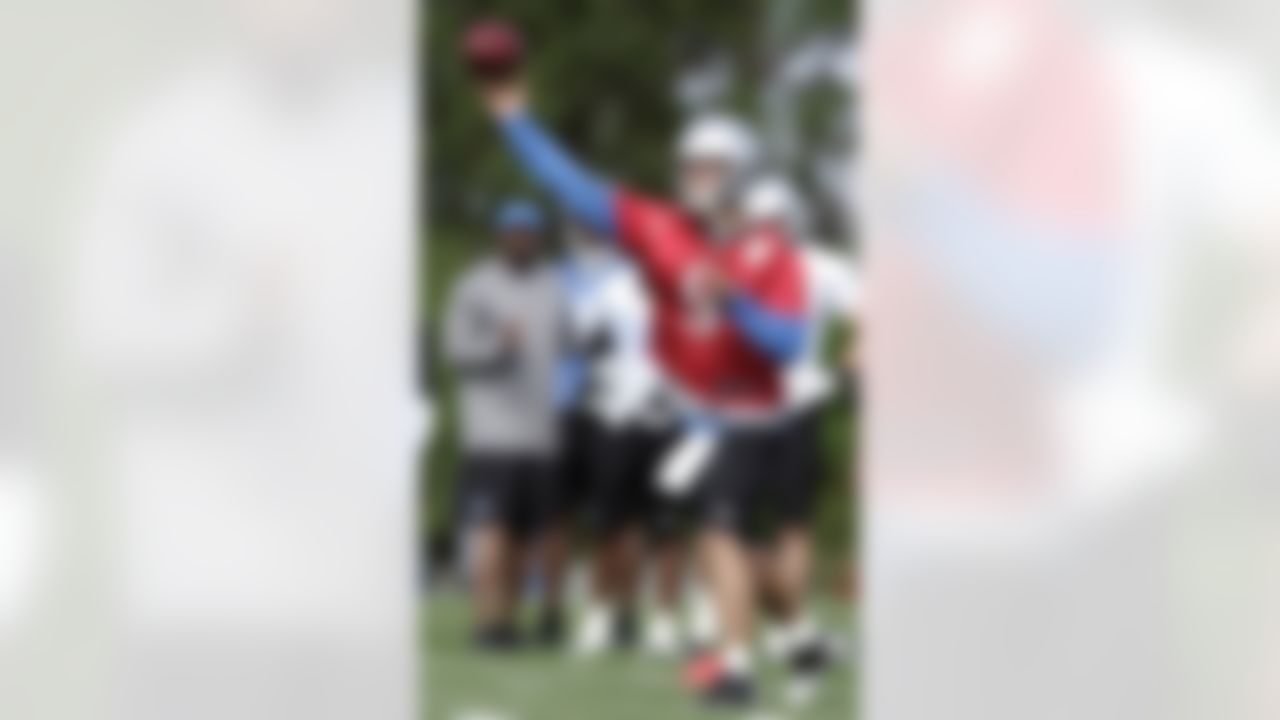 Detroit Lions quarterback Matthew Stafford tosses a pas during their NFL football training camp Saturday, July 28, 2012, in Allen Park, Mich. (AP Photo/Duane Burleson)