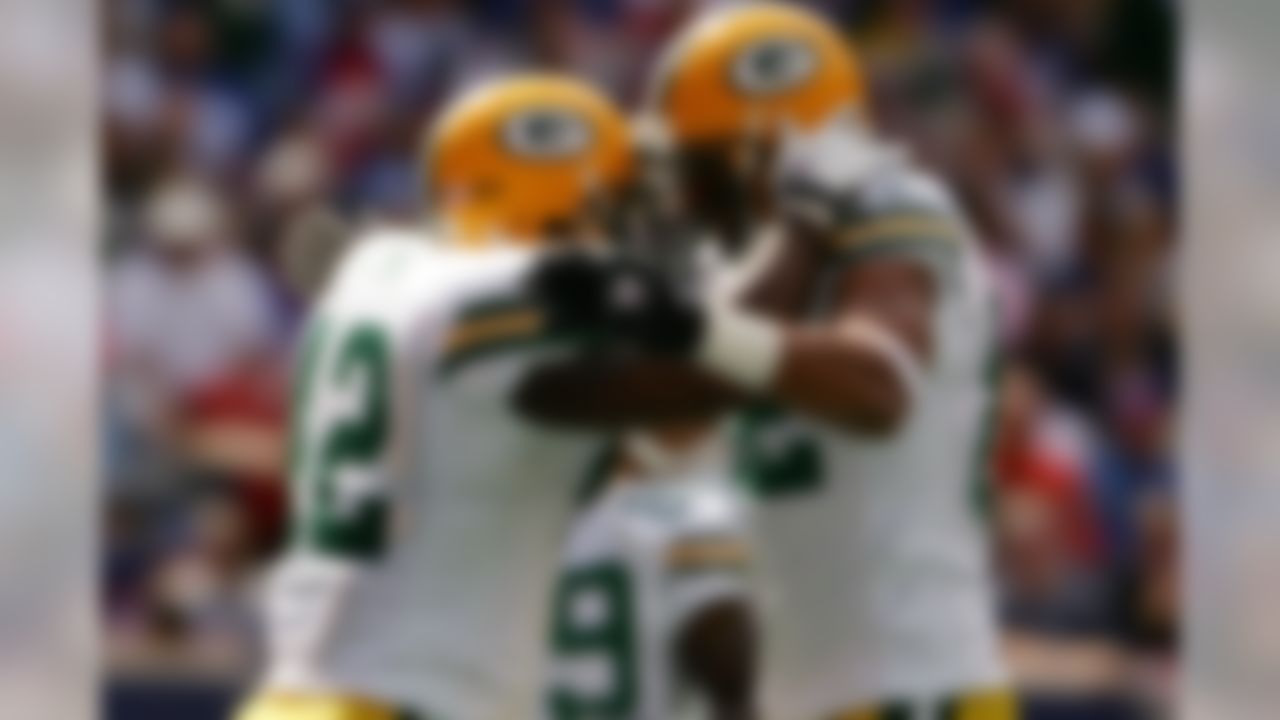 EAST RUTHERFORD, NJ - SEPTEMBER 16:  DeShawn Wynn #42 (L) of the Green Bay packers is congratulated by teammate Ruvell Martin #82 after scoring a touchdown against the New York Giants on September 16, 2007 at Giants Stadium in East Rutherford, New Jersey.  (Photo by Chris McGrath/Getty Images)