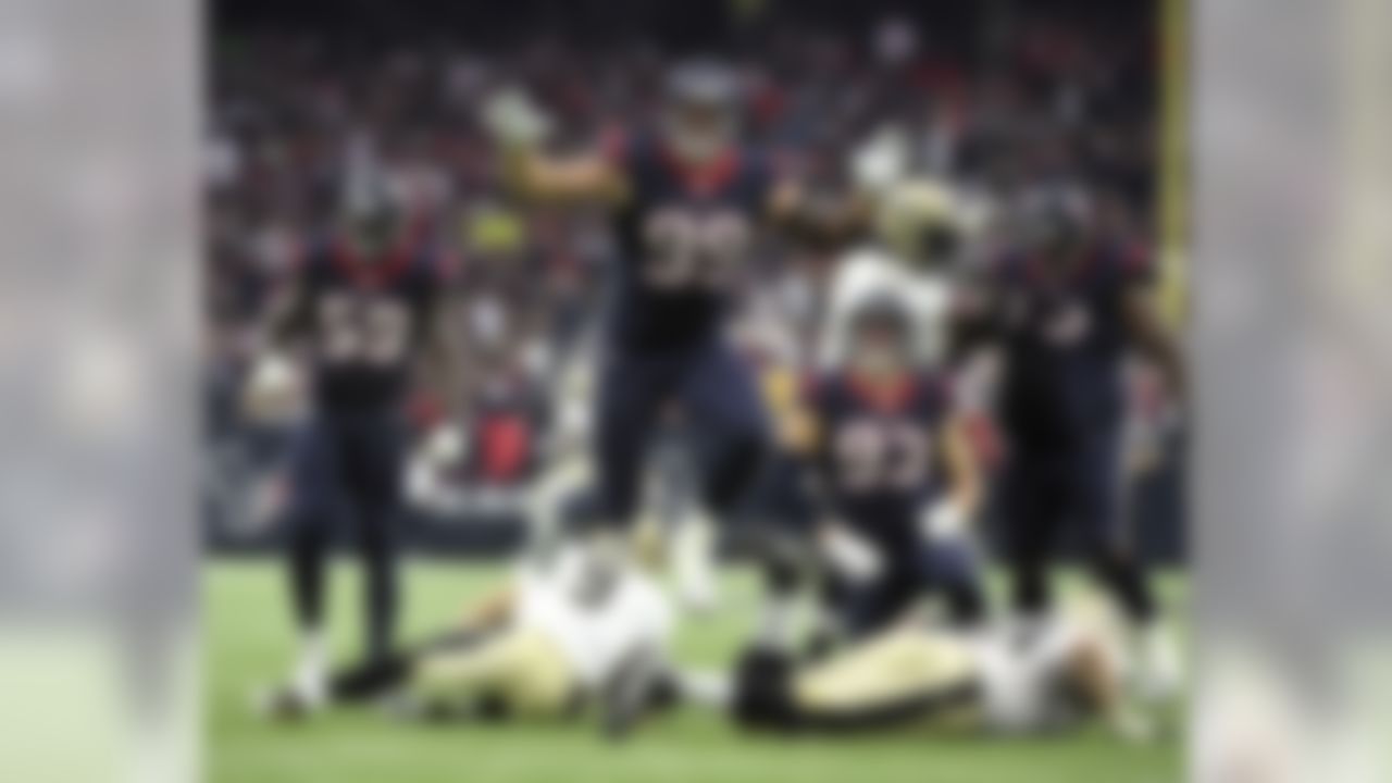 Houston Texans defensive end J.J. Watt (99) leaps after sacking New Orleans Saints quarterback Drew Brees (9) during the third quarter of an NFL football game, Sunday, Nov. 29, 2015, in Houston. (AP Photo/Eric Christian Smith)