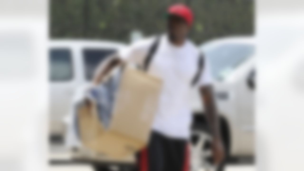 Houston Texans football wide receiver Andre Johnson arrives to report for NFL football training camp, Friday, July 27, 2012, in Houston. The Texans went 10-6 last season and won its first playoff game in 2011 resulting in higher-than-ever expectations. (AP Photo/Pat Sullivan)