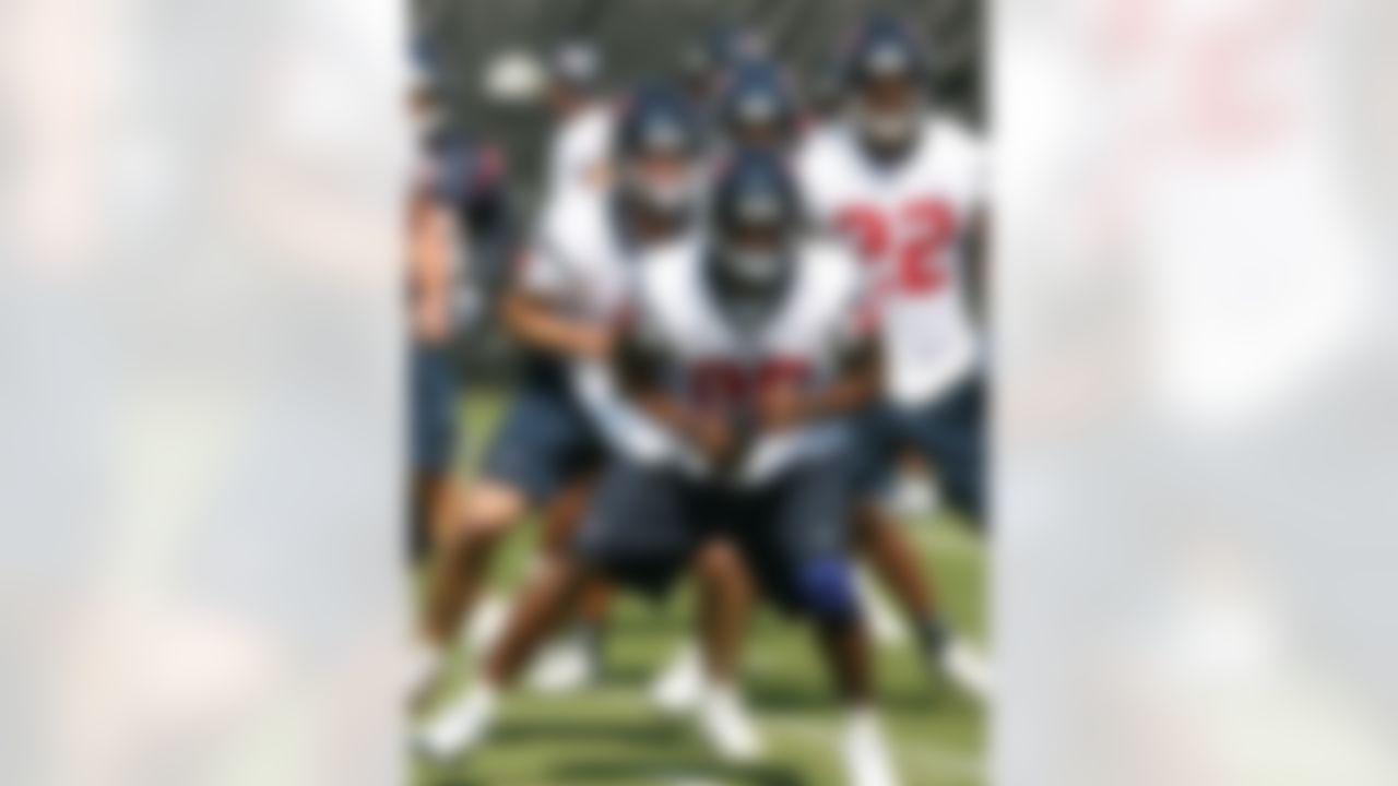 HOUSTON - MAY 09:  Wide receiver Andre Johnson #80, quarternack Matt Schaub, behind, and running back Chris Brown #22 of the Houston Texans warm up during a morning practice session May 9, 2008 in Houston, Texas.  (Photo by Bob Levey/Getty Images)