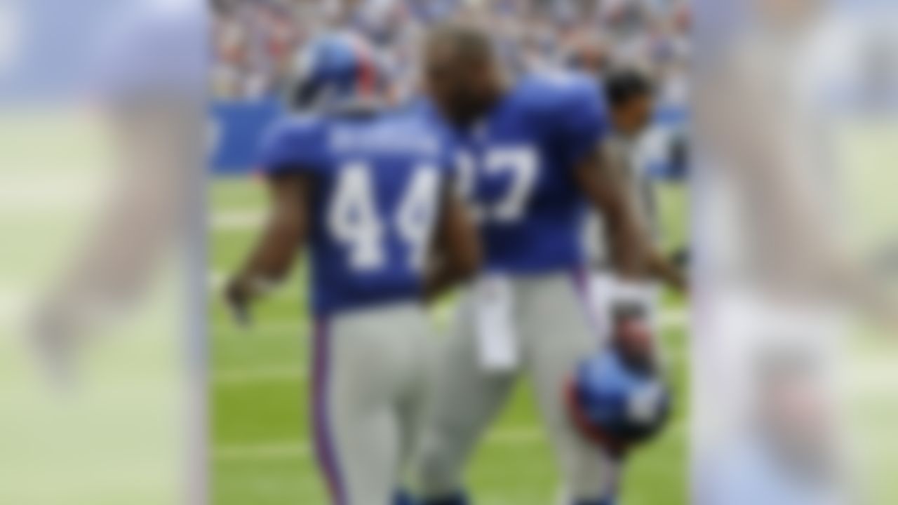 New York Giants running back Brandon Jacobs (27) celebrates with teammate Ahmad Bradshaw (44) after Bradshaw scored a touchdown during the second quarter of an NFL football game against the Tennessee Titans at New Meadowlands Stadium on Sunday, Sept. 26, 2010, in East Rutherford, N.J. (AP Photo/Bill Kostroun)