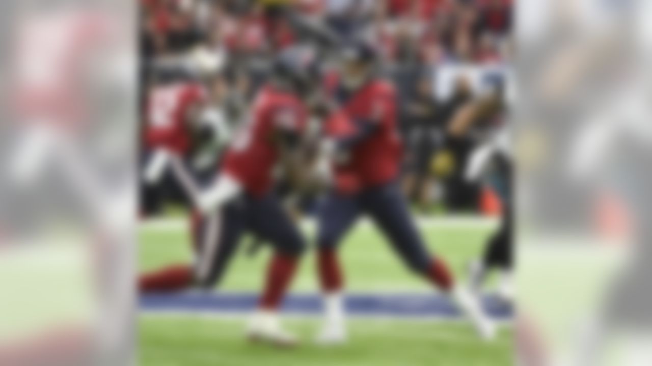 Houston Texans quarterback Tom Savage (3) hands off to Lamar Miller (26) after being brought in to replace Brock Osweiler during the first half of an NFL football game against the Jacksonville Jaguars, Sunday, Dec. 18, 2016, in Houston. (AP Photo/Eric Christian Smith)