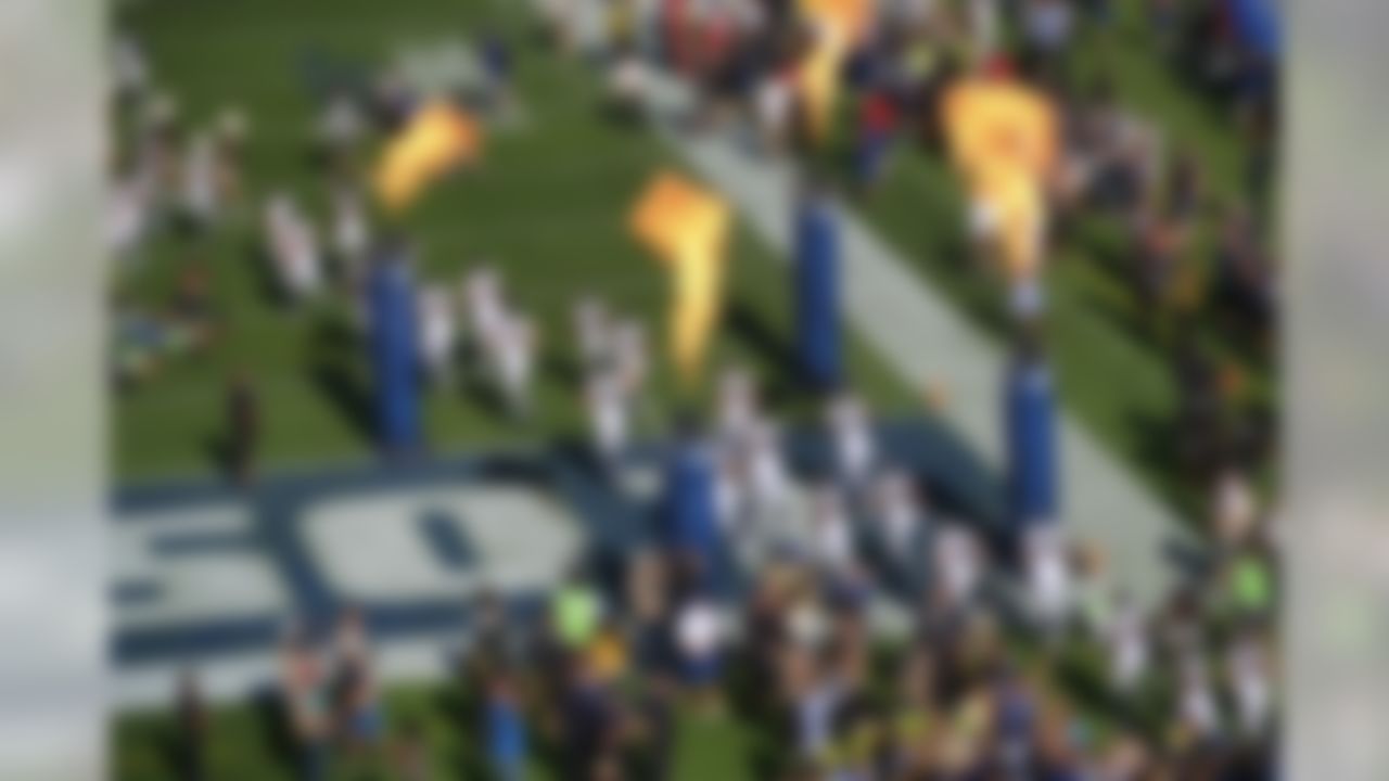 The Los Angeles Rams take the field as fire effects go off at Los Angeles Memorial Coliseum for a preseason NFL football game against the Dallas Cowboys, Saturday, Aug. 13, 2016, in Los Angeles. (AP Photo/Richard Vogel)