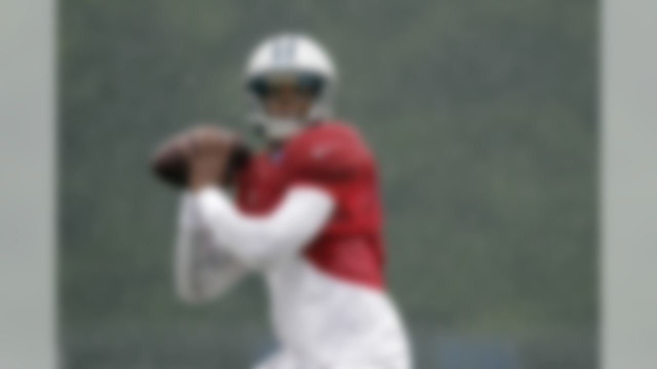 Carolina Panthers quarterback Cam Newton throws a pass during practice at the NFL team's football training camp in Spartanburg, S.C., Tuesday, July 31, 2012. (AP Photo/Chuck Burton)
