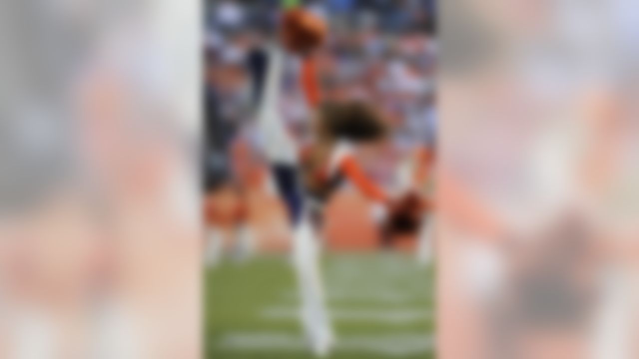A Denver Broncos cheerleader performs on the field during a timeout in the third quarter of an NFL football game against the Detroit Lions, Sunday, Oct. 30, 2011, in Denver. (AP Photo/Jack Dempsey)